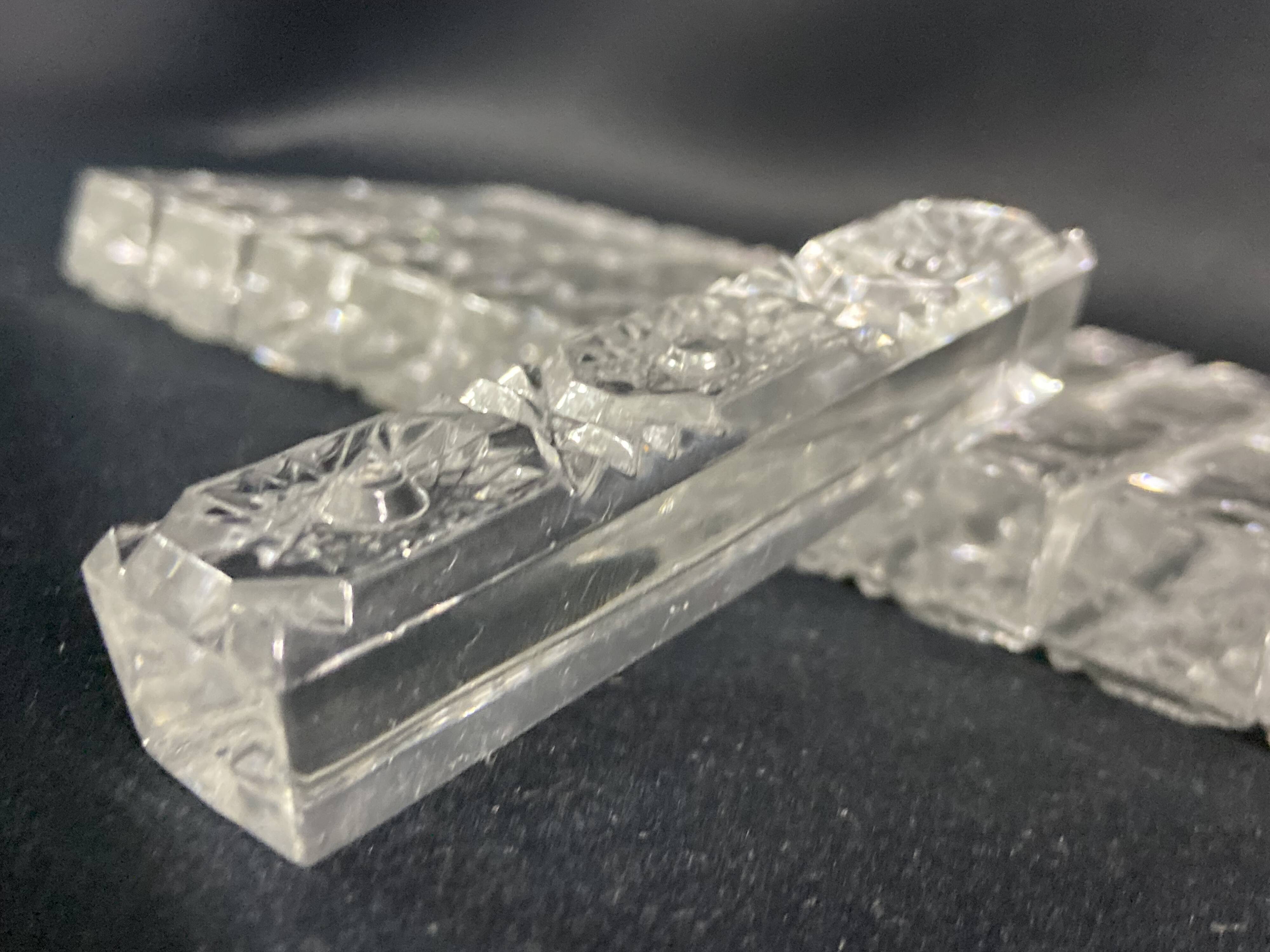 Set of 12 molded glass or crystal knife rests with diamond point decor