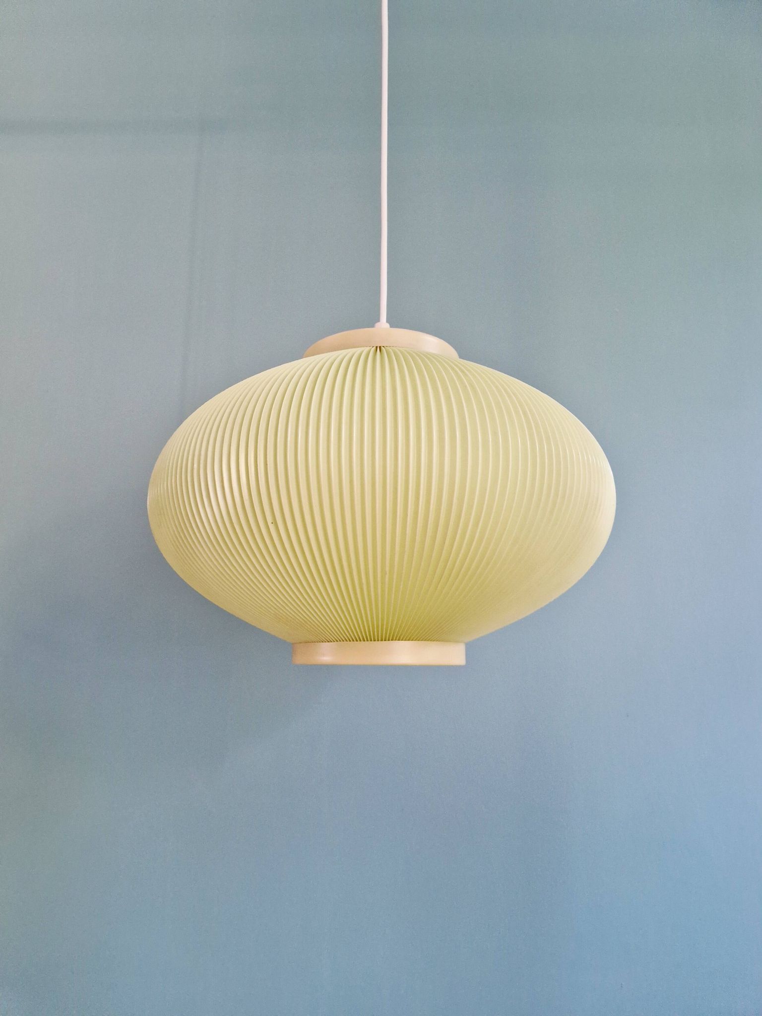 Vintage oval-shaped suspension in pleated celluloid, light green colour, 1960.