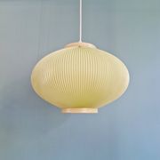 Vintage oval-shaped suspension in pleated celluloid, light green colour, 1960.