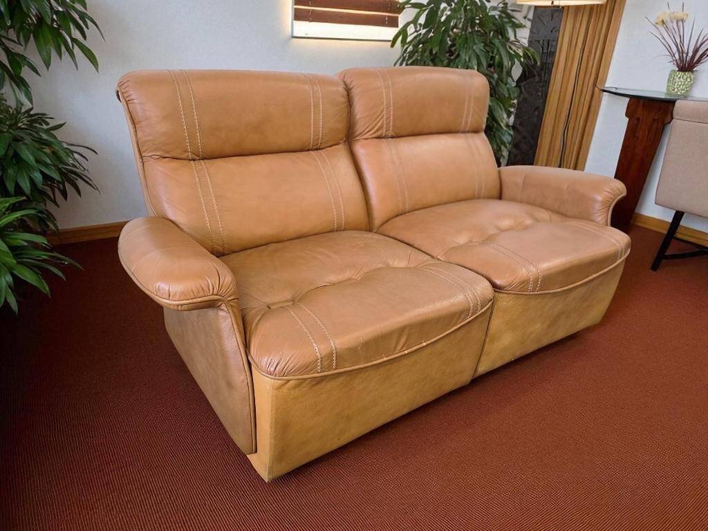 Vintage two-seater cognac leather sofa