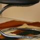 Cobra chairs in steel and black leather by Giotto Stoppino, 1970s, set of 5.