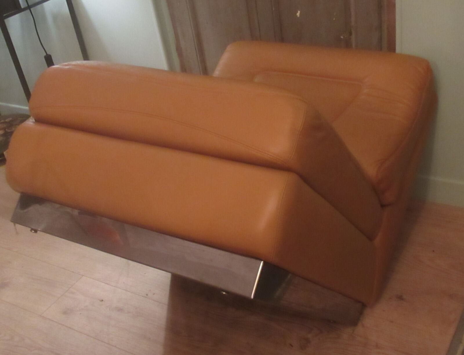 Leather armchair, stainless steel base, 70s