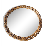 Round mirror in vintage wicker