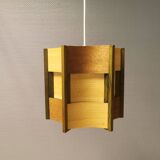 Older lamp in wood veneer, partially painted in green colour.