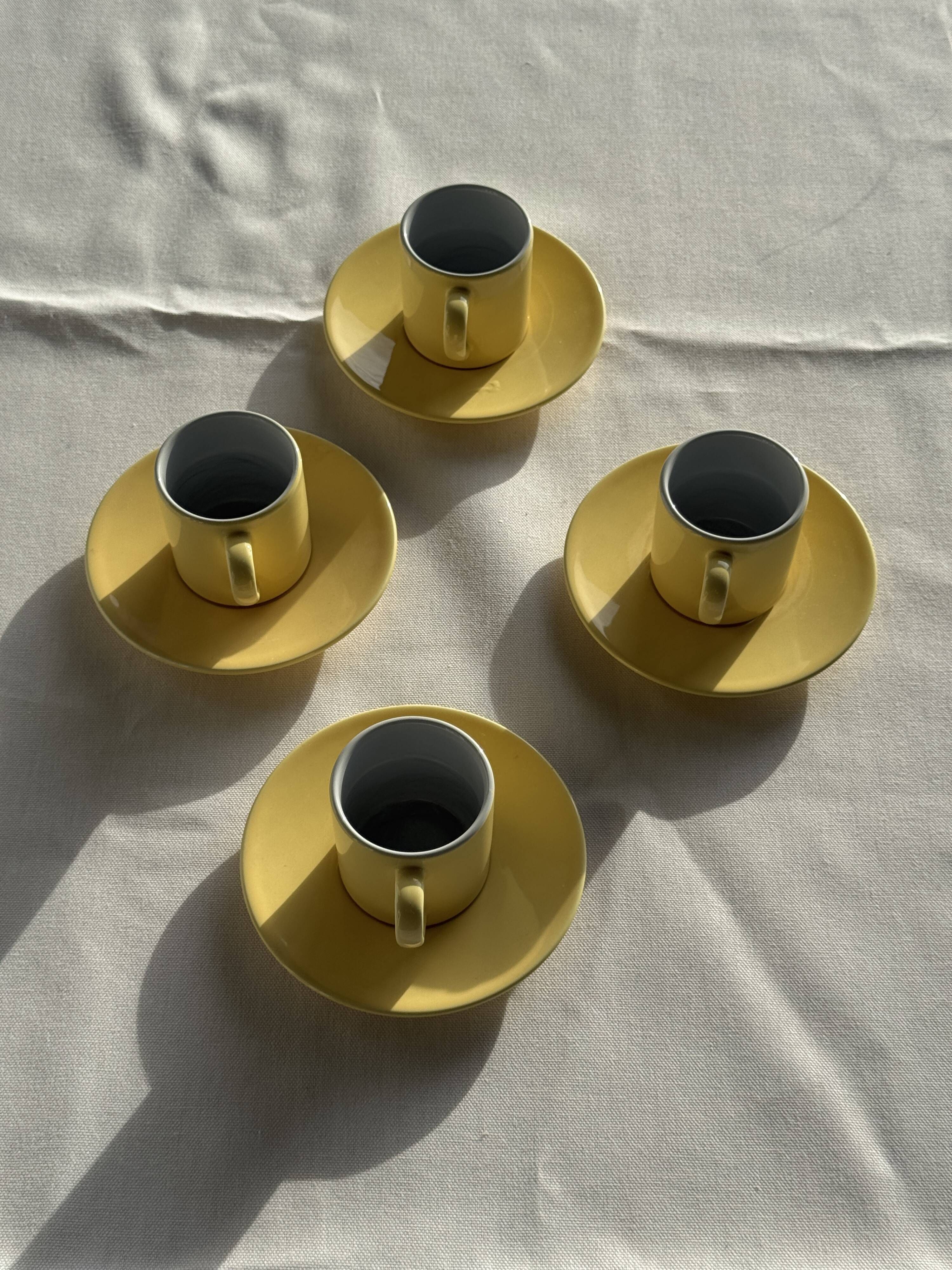 Set of 4 vintage yellow Italian espresso cups and saucers.