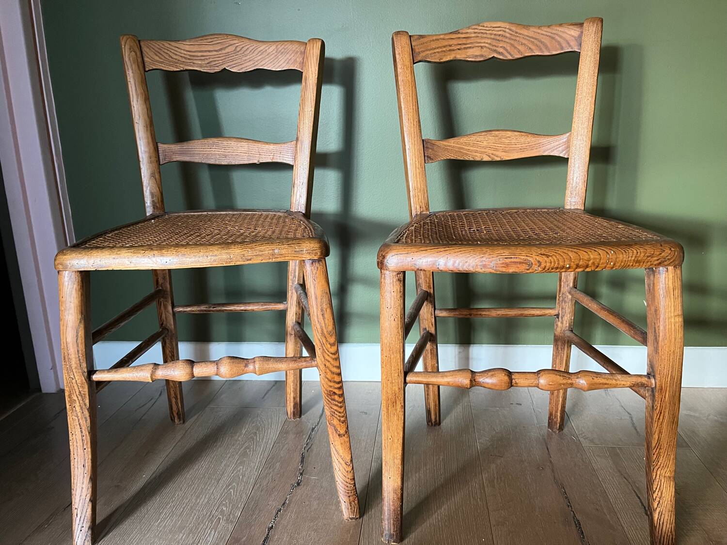 Pair of vintage chairs from the late 20th century with caning.