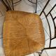 Table and four wrought iron and wood chairs.