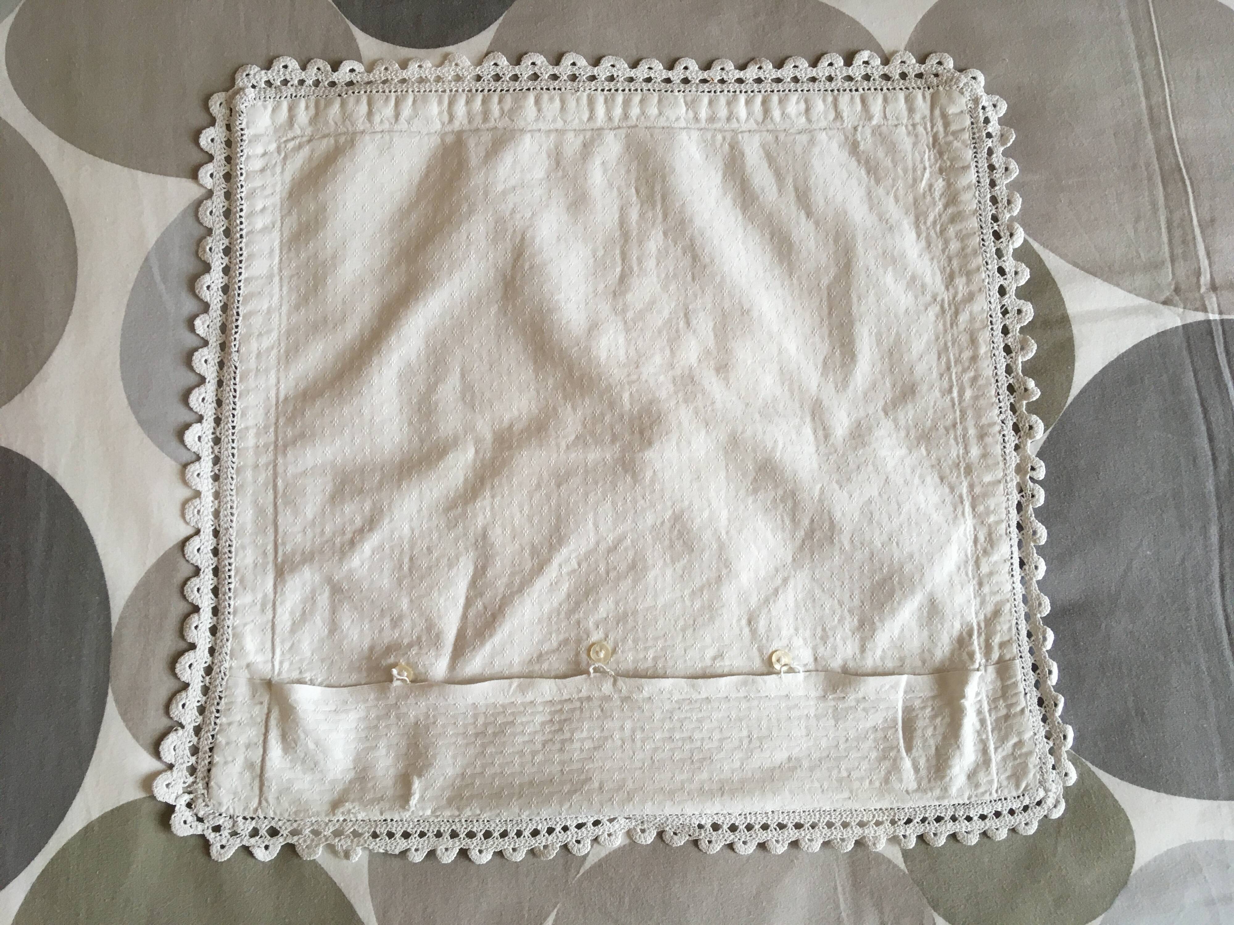 A handmade lace cushion cover