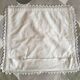 A handmade lace cushion cover