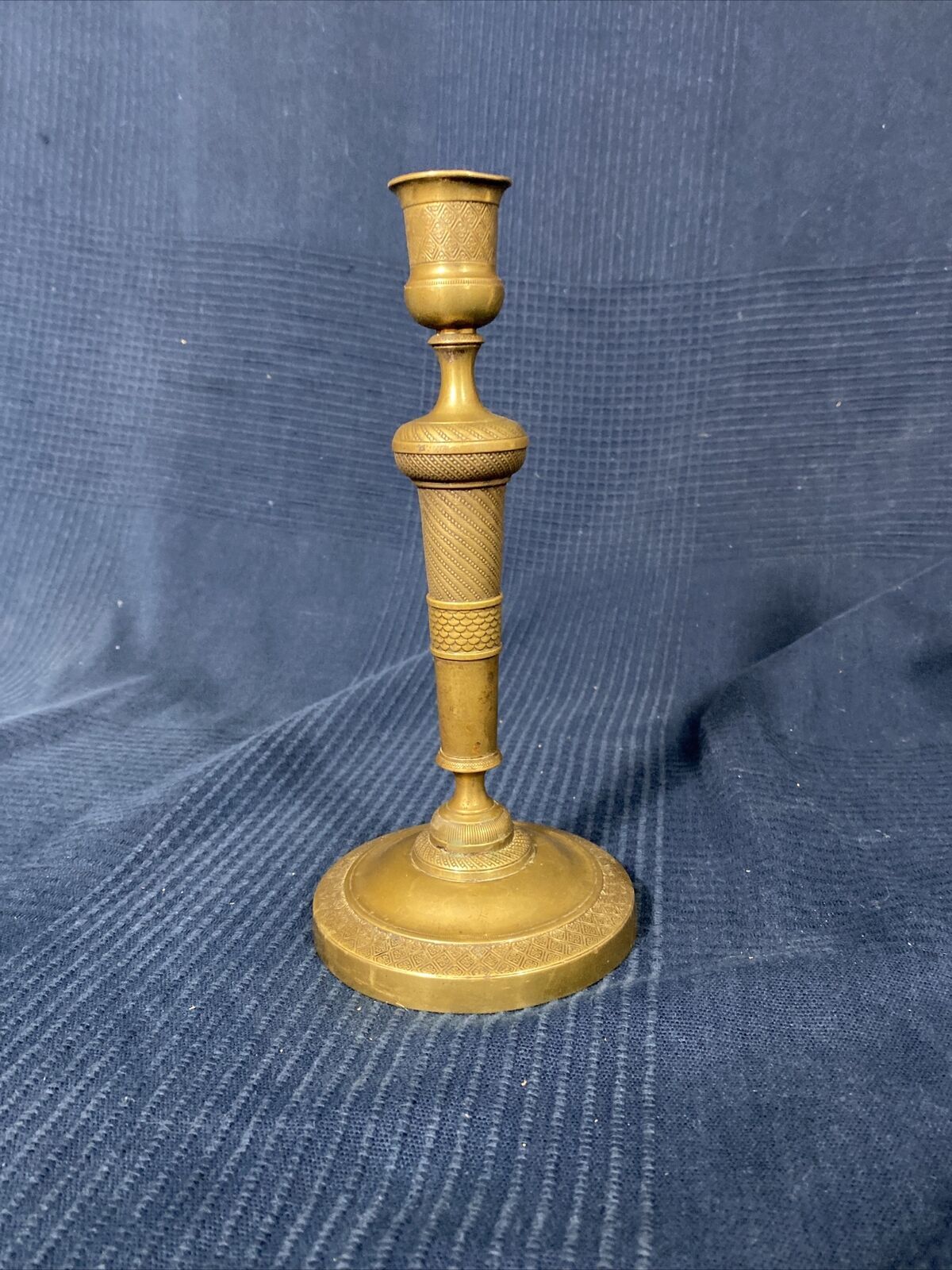 Old Louis-style brass candlestick