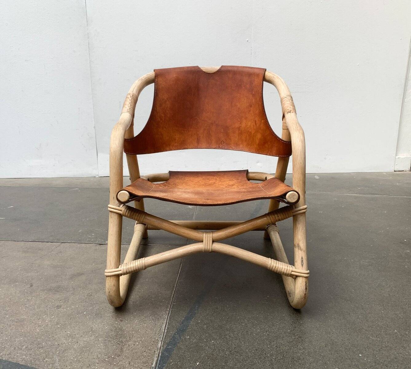 Mid-century safari lounge chair in bamboo and Danish leather, 1960s.