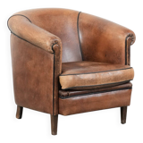 Sturdy vintage sheepskin club armchair with a beautiful patina