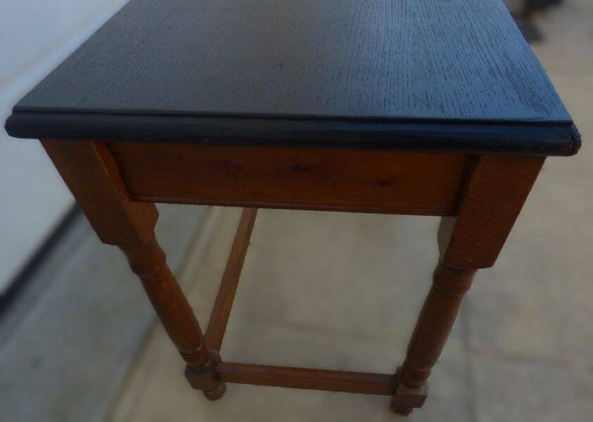 Nightstand or side table in solid wood with a black top.