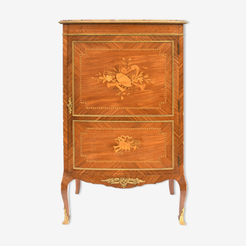 In-between furniture in marquetry decorated with a trophy decoration of musical instruments