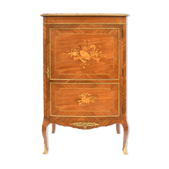 In-between furniture in marquetry decorated with a trophy decoration of musical instruments