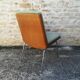 Shell chairs and green fabric