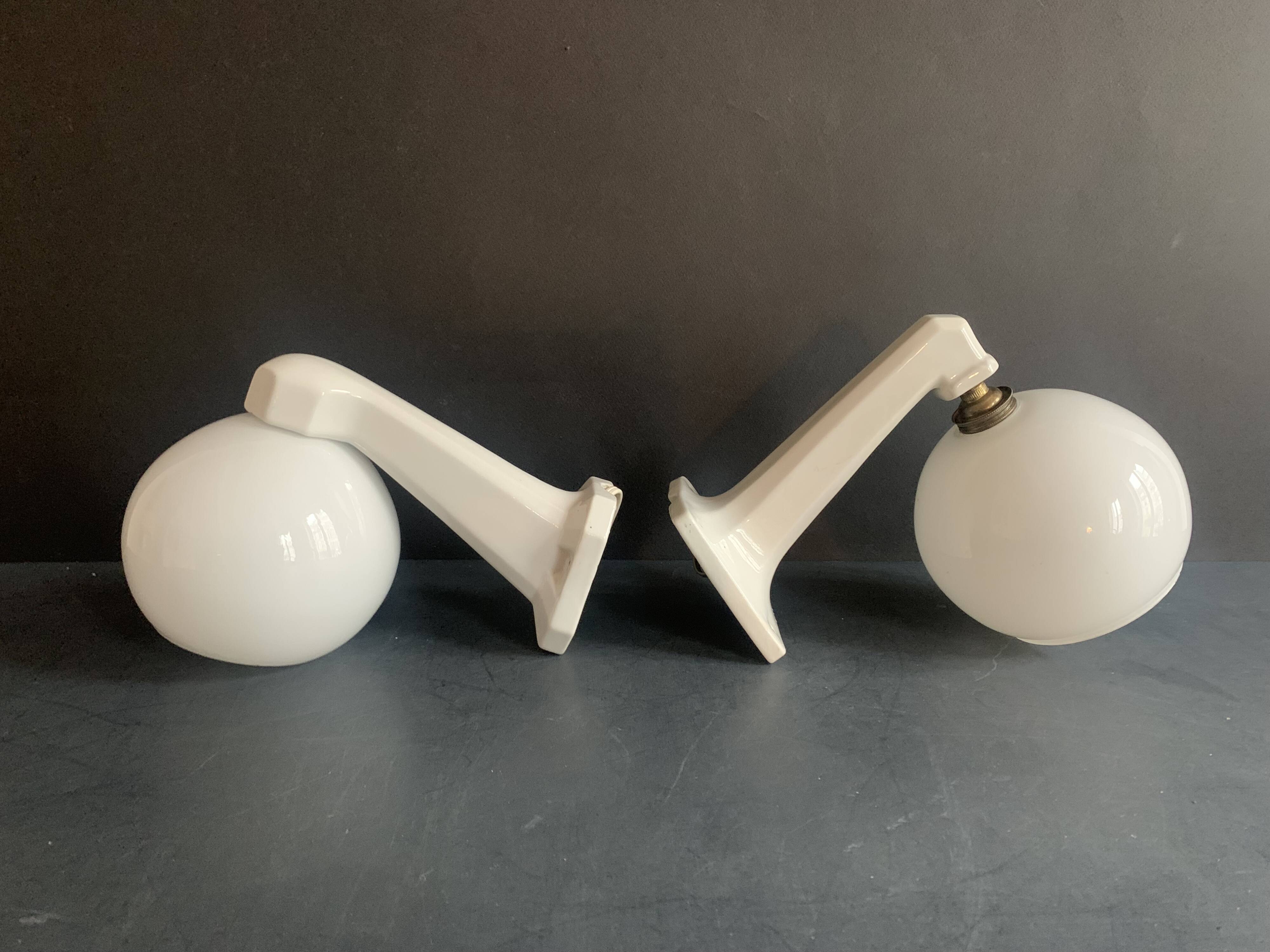 Pair of Art Deco porcelain wall lights with white Opaline globes, 1920