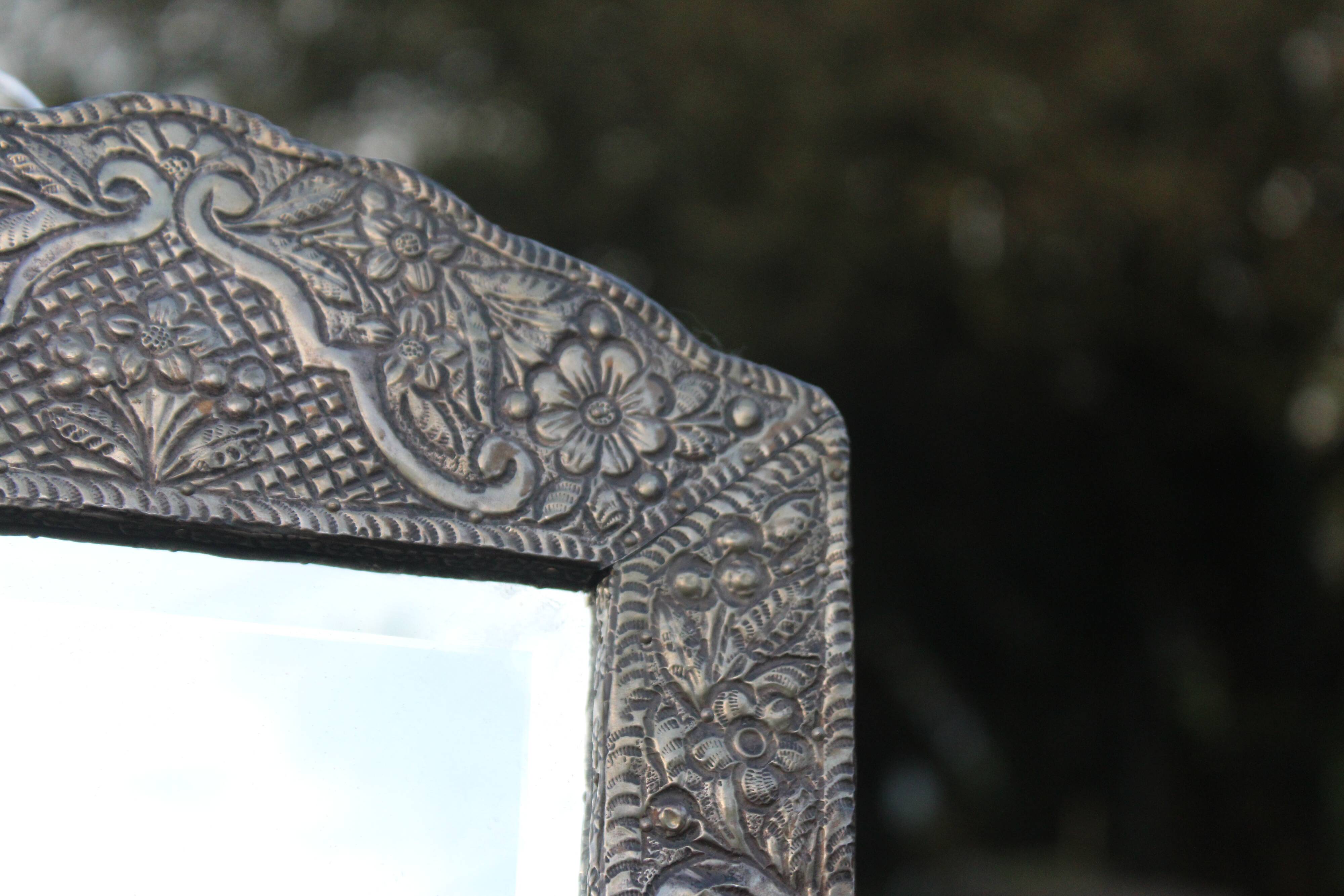 Oriental mirror in chiseled metal – beveled, for placing on a surface or hanging