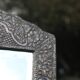 Oriental mirror in chiseled metal – beveled, for placing on a surface or hanging
