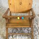 Chaise bébé aux pieds compas