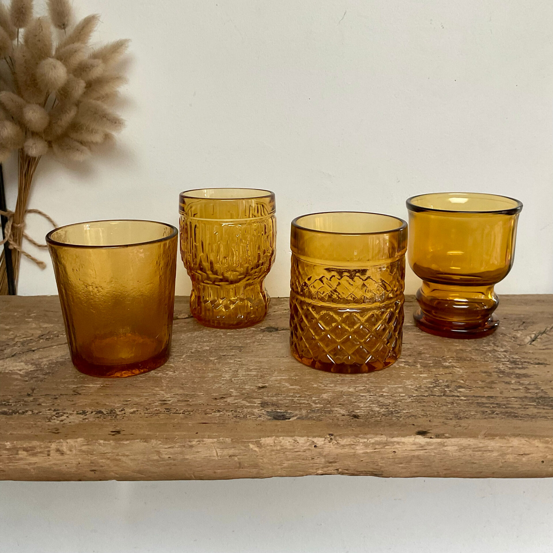 4 mismatched amber glasses