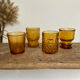 4 mismatched amber glasses