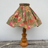 Turned wood lamp with flower shade