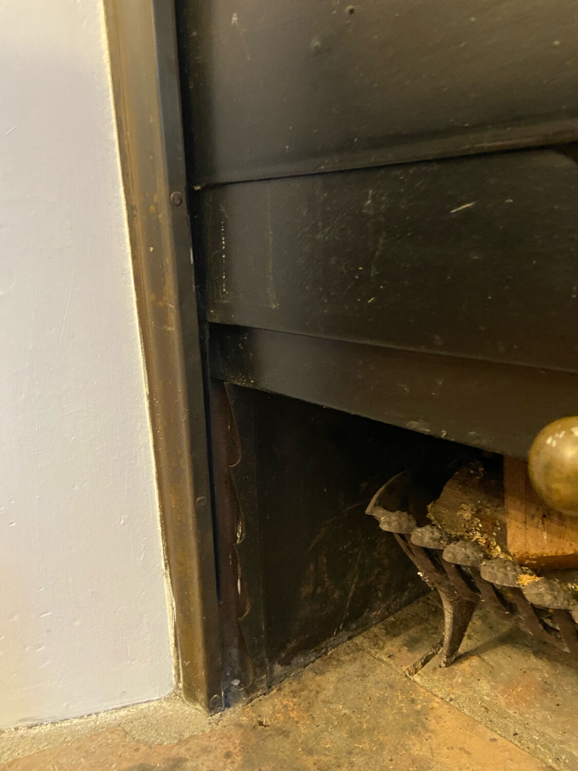 Marble fireplace surround with closed hearth frame.