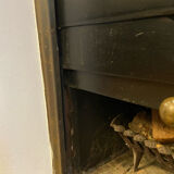 Marble fireplace surround with closed hearth frame.