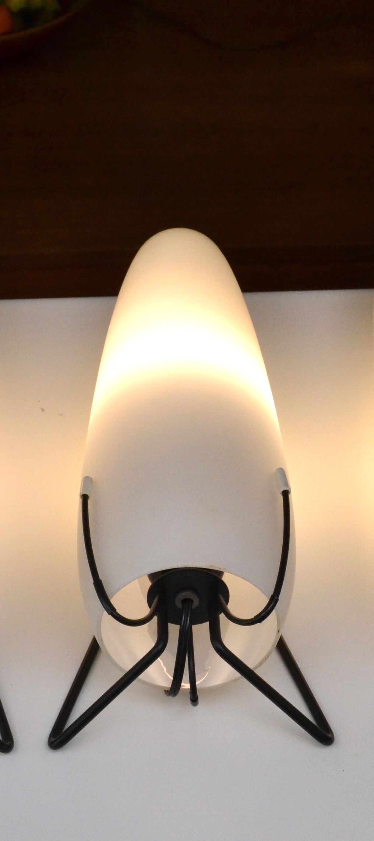 Louis Kalff opaline and metal wall light from the 1950s.