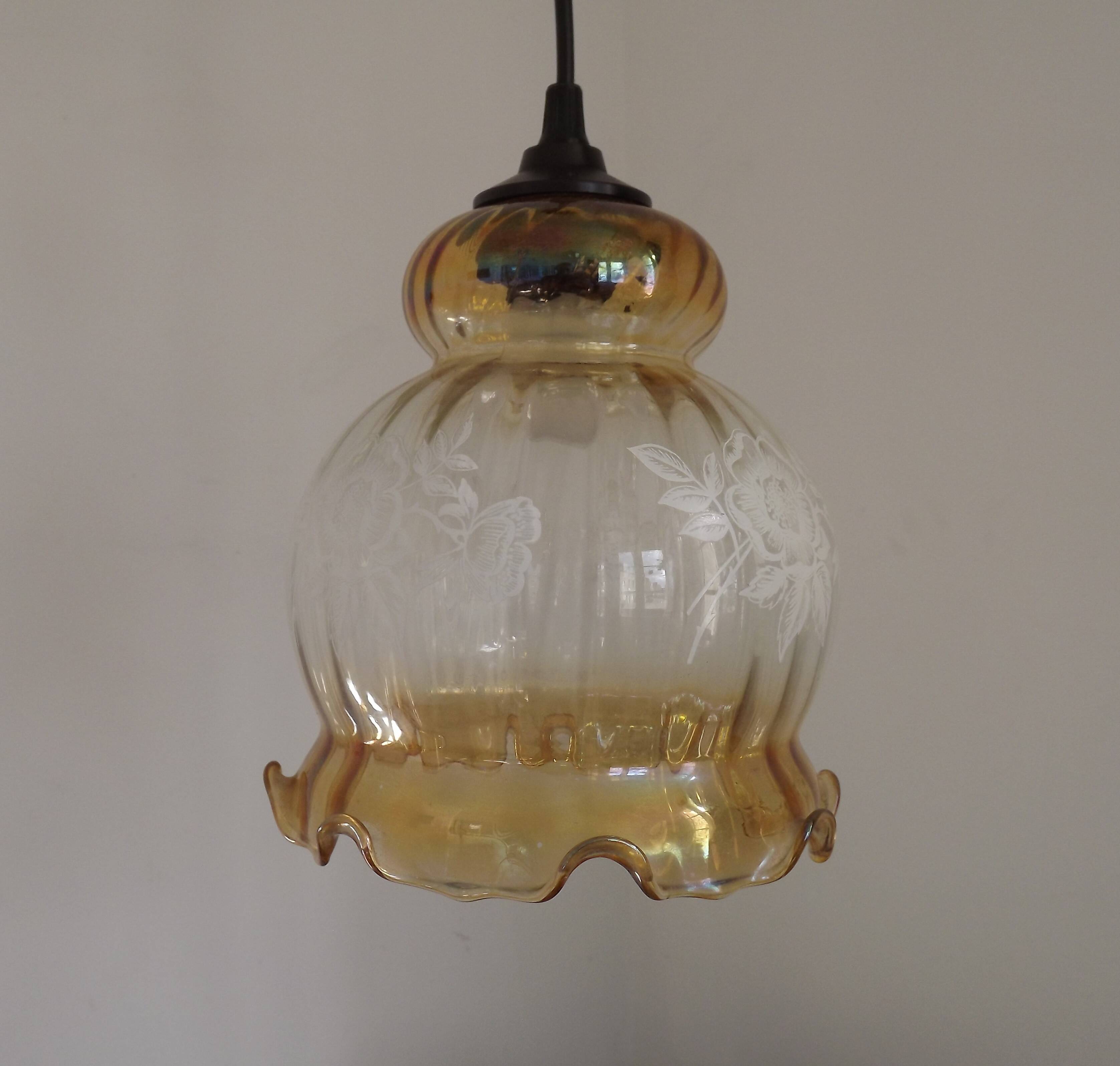 French vintage amber and clear glass ceiling light with white floral decoration.