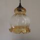 French vintage amber and clear glass ceiling light with white floral decoration.