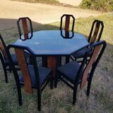 Octagonal table paul michel and its black lacquered chairs and elm magnifying glass