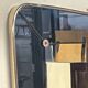 1950s double-thickness wall mirror with brass profile and supports.