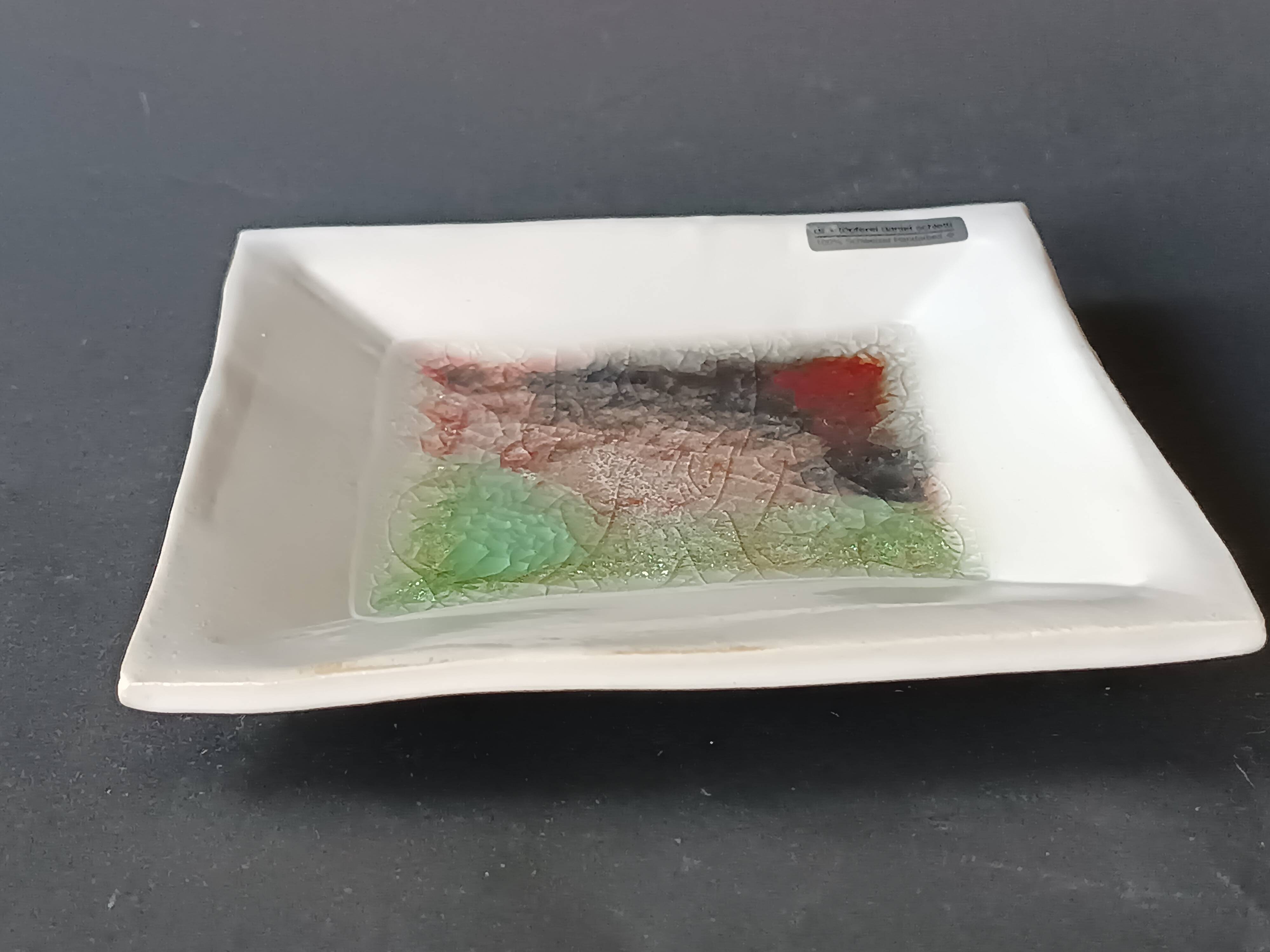 White ceramic and green crystal glass catch-all by Daniel Schletti.
