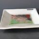 White ceramic and green crystal glass catch-all by Daniel Schletti.