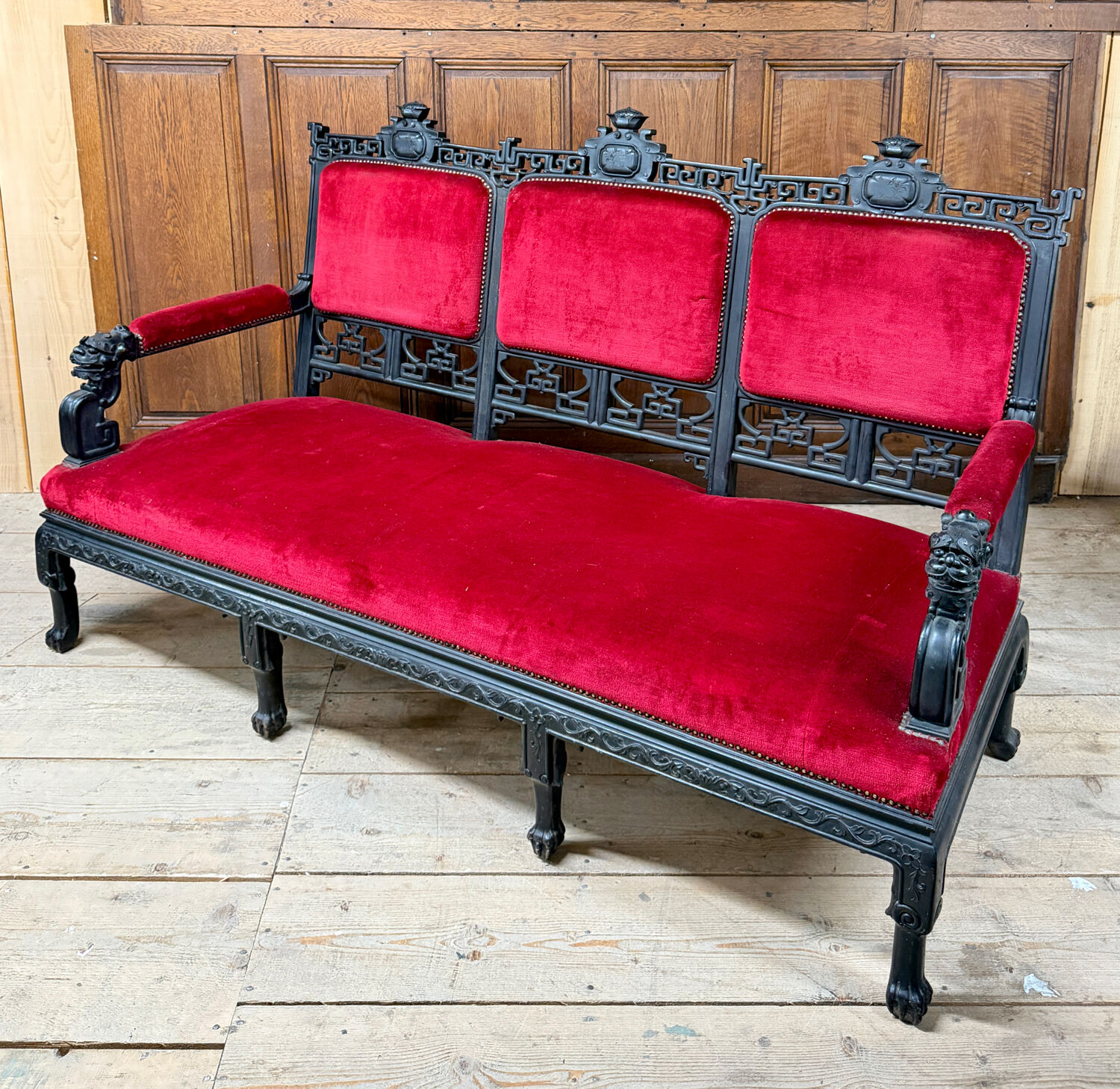 Large Japanese-style sofa in carved wood and red velvet, 19th century