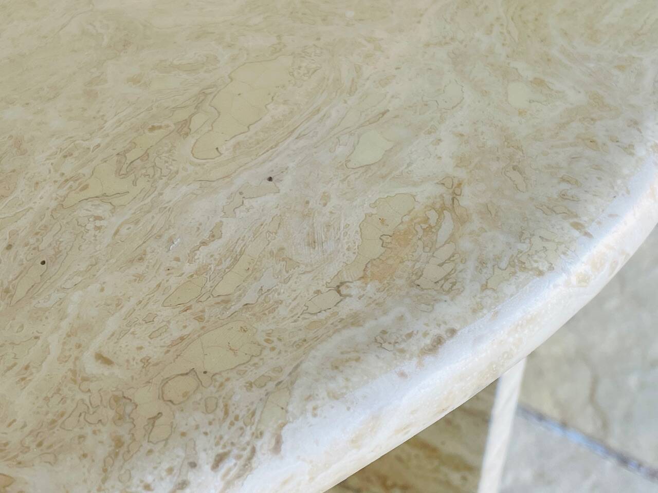 Vintage side table in travertine, circa 1980s.