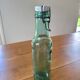 Vintage glass bottle l'Idéale with porcelain stopper