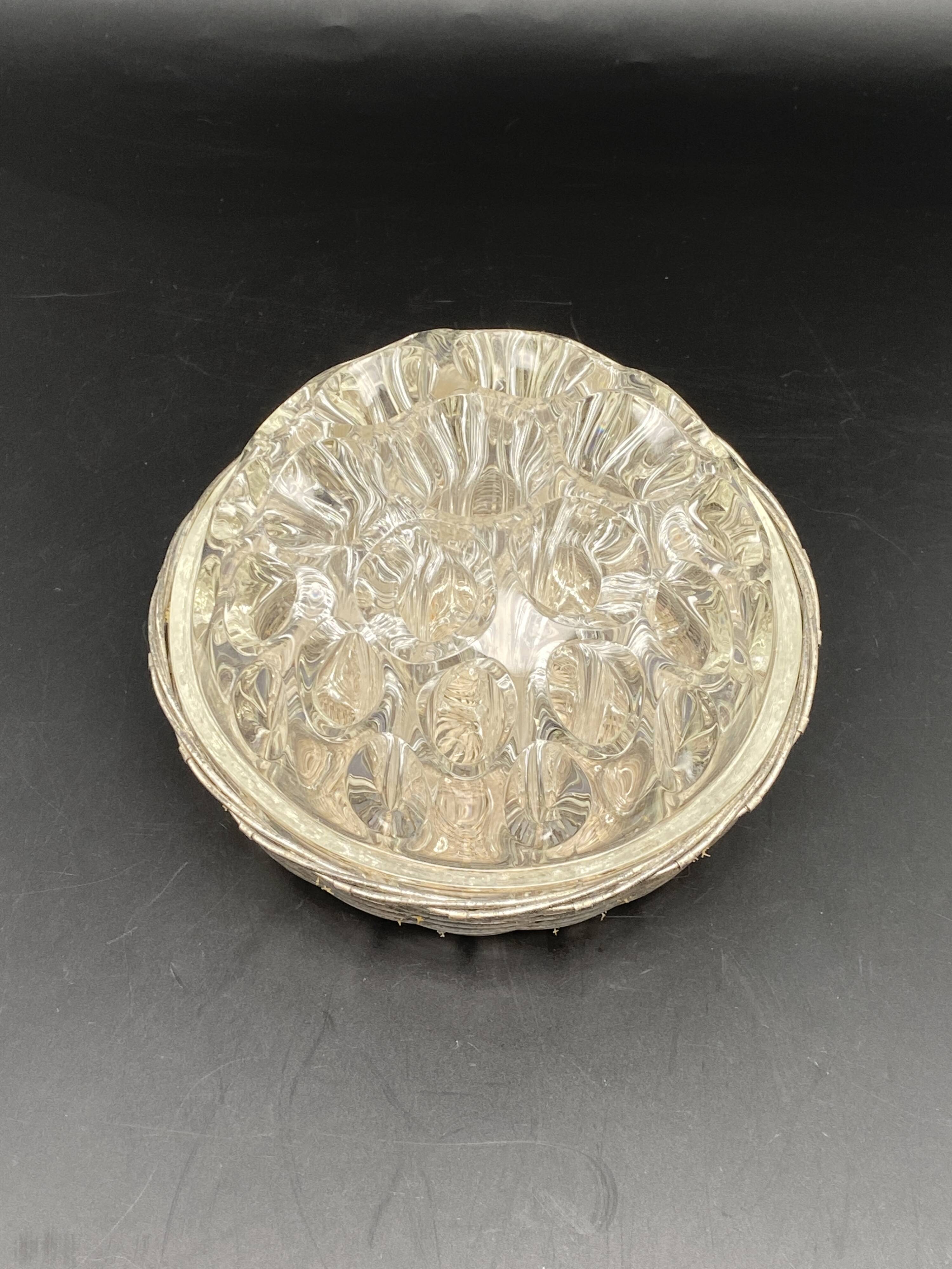 Glass flower stand with woven metal support