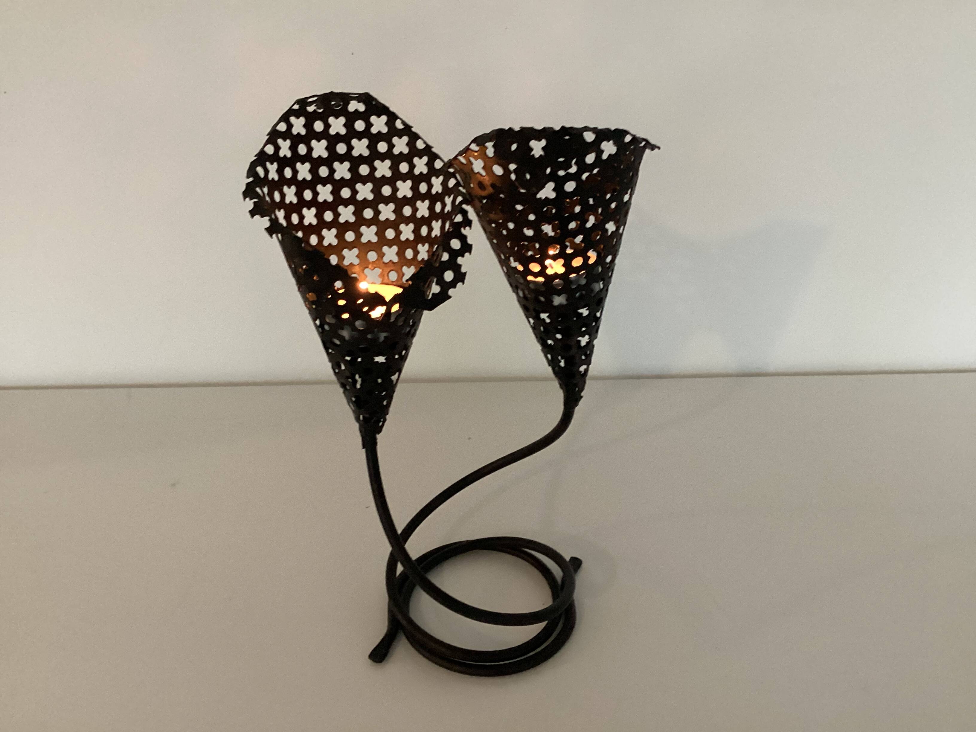 Perforated metal candle holder