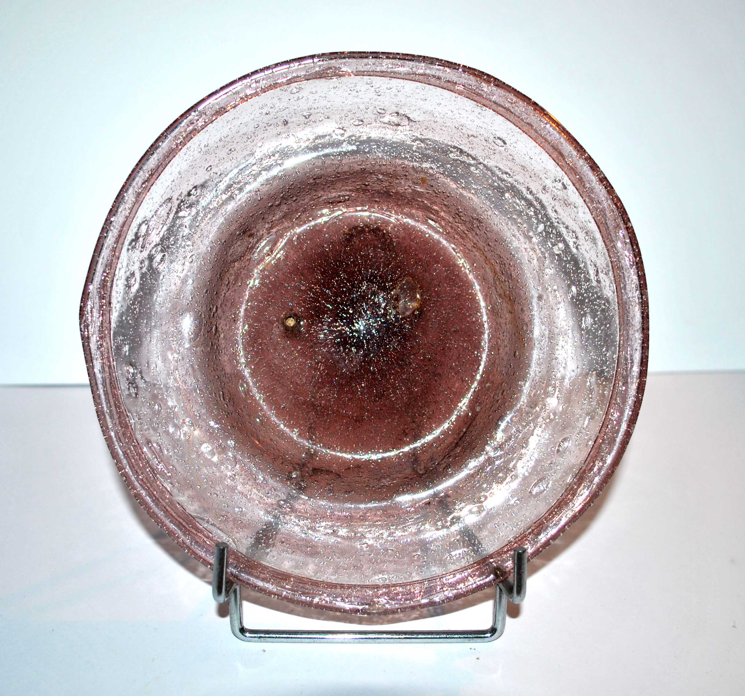 Antique plate in pink bubbled blown glass