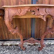 Pair of carved wall consoles in Louis XV style