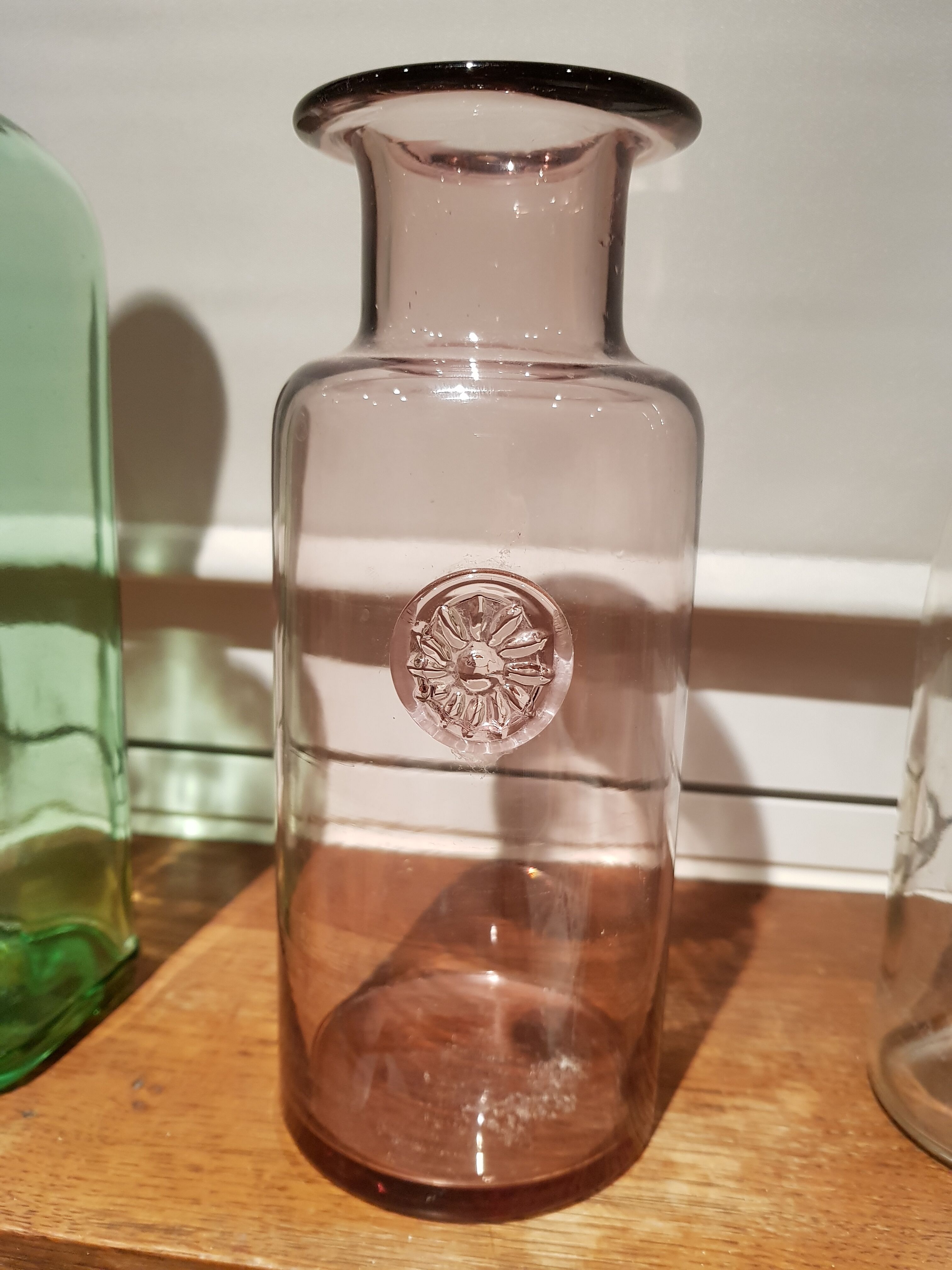Goose-hued glass apothecary bottle