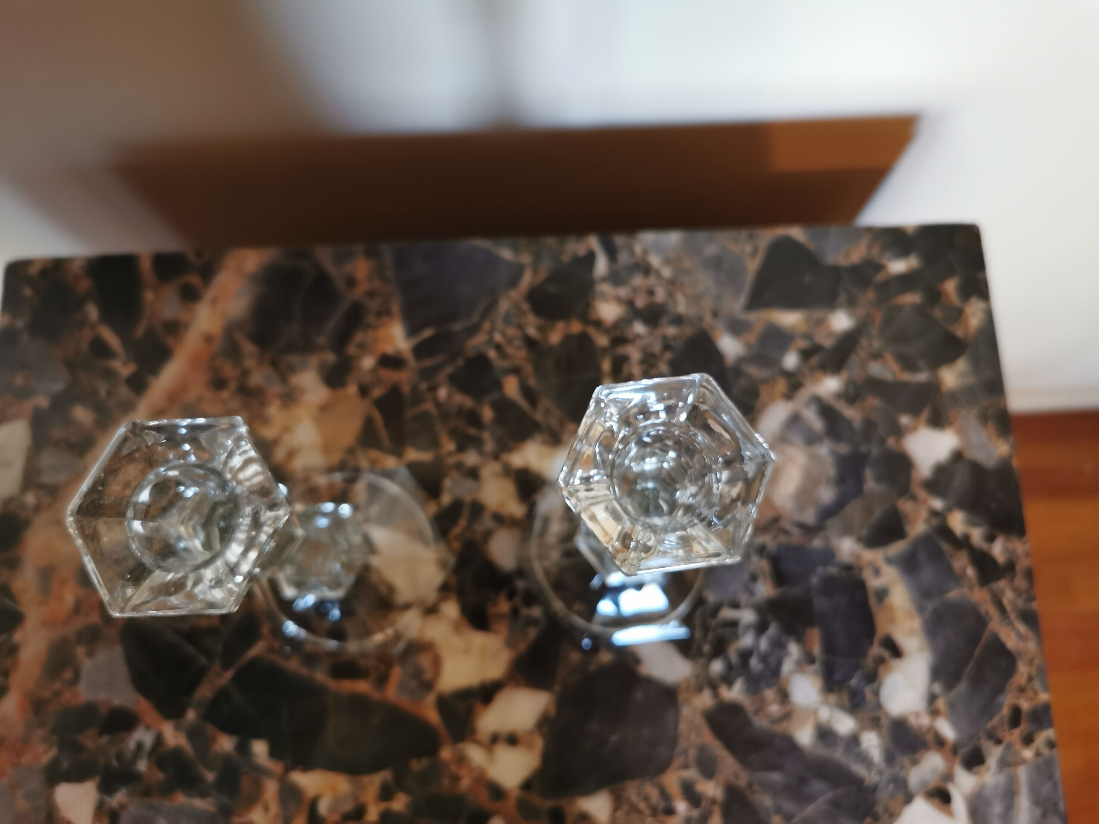 Pair of antique candle holders in transparent glass