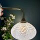 Vintage glass wall lamp with a white Clichy shade.