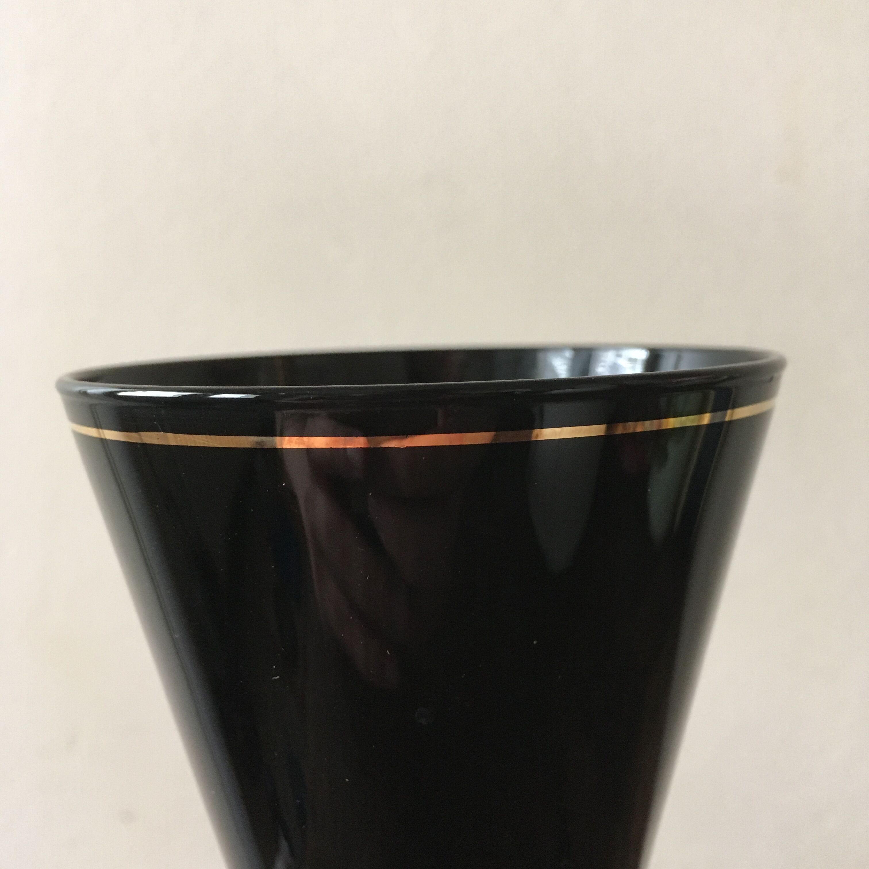 Large black vase with faience gold edging