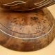 Antique mirror on wooden stand and metal net