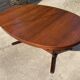 Baumann round oval extendable Scandinavian table in rosewood with 2 extensions.