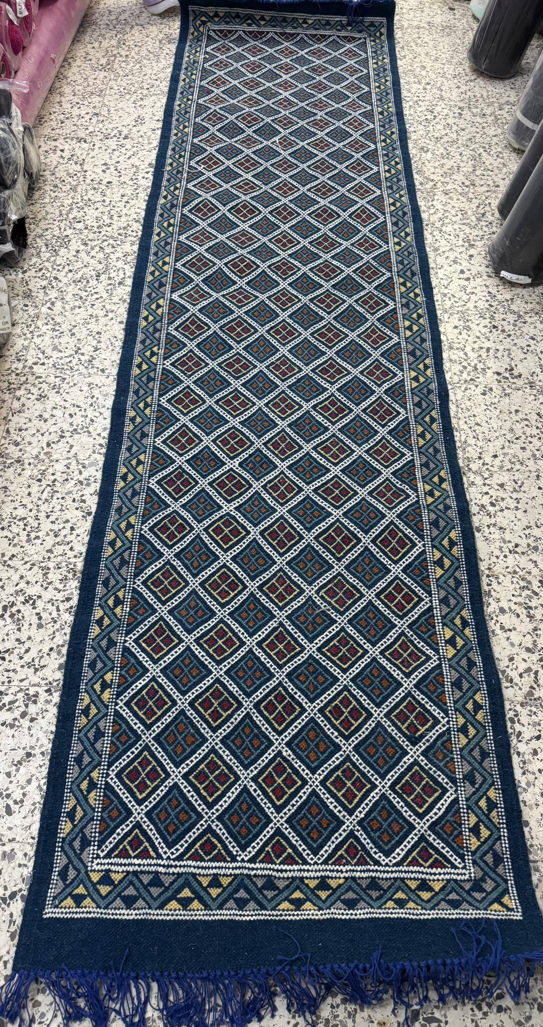 Hand-woven blue hallway rug in natural wool
